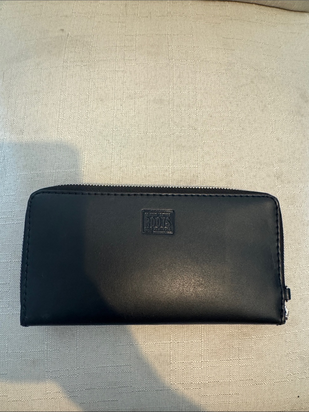 ROOTS Black Zip-Around Leather Wallet